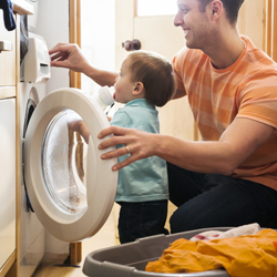 father and child with energy efficient washer